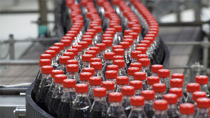Coke bottles on production line